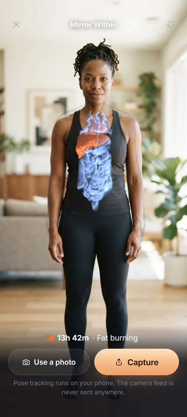 Mirror Within: a woman on a balcony at sunrise with the glass organs drawn over her body, the liver glowing orange, and the line 13h 42m, Fat burning.